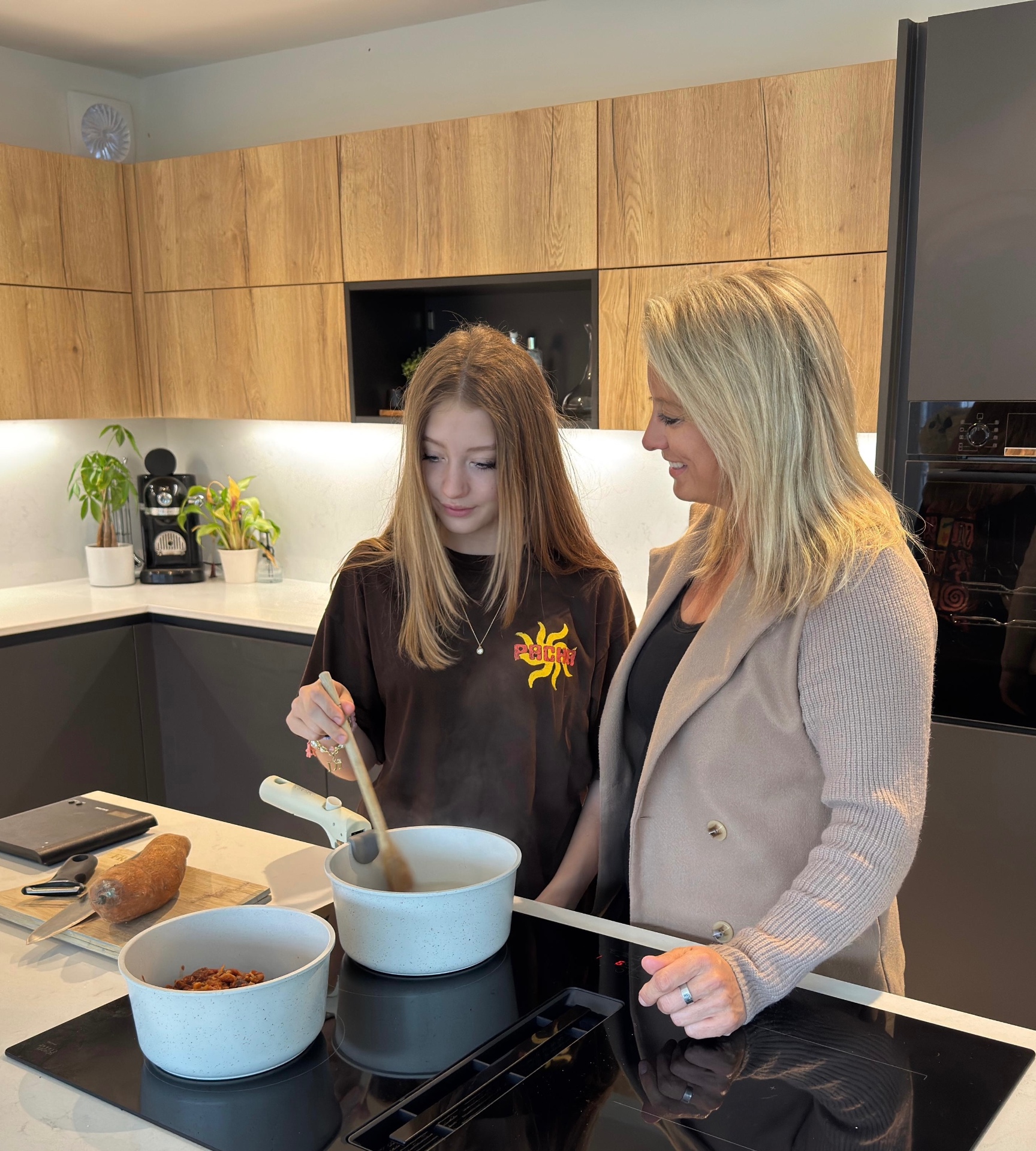 Kate Bell with her daughter Niyah cooking together